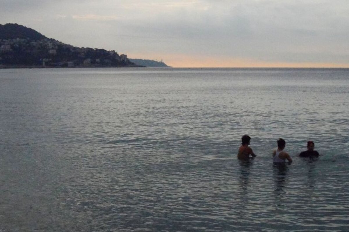 two people on bike submerged in water