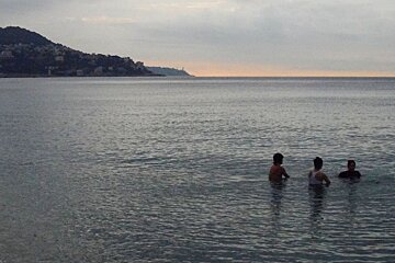 two people on bike submerged in water