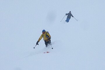 two skiers following eachother