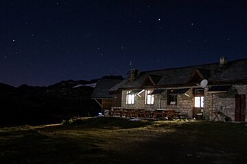 a mountain refuge at night tignes