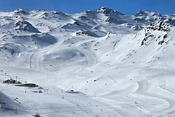 looking down on the Val Thorens ski resort on a sunny day in March