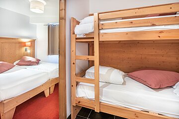 A bunk bed with a sticker on it that says ' emergency exit '