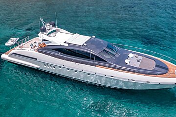 A large yacht is floating on top of a body of water