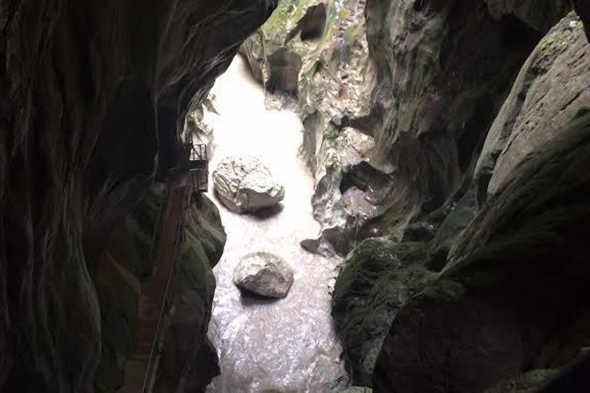 looking down into a deep cave