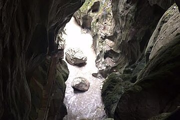 looking down into a deep cave