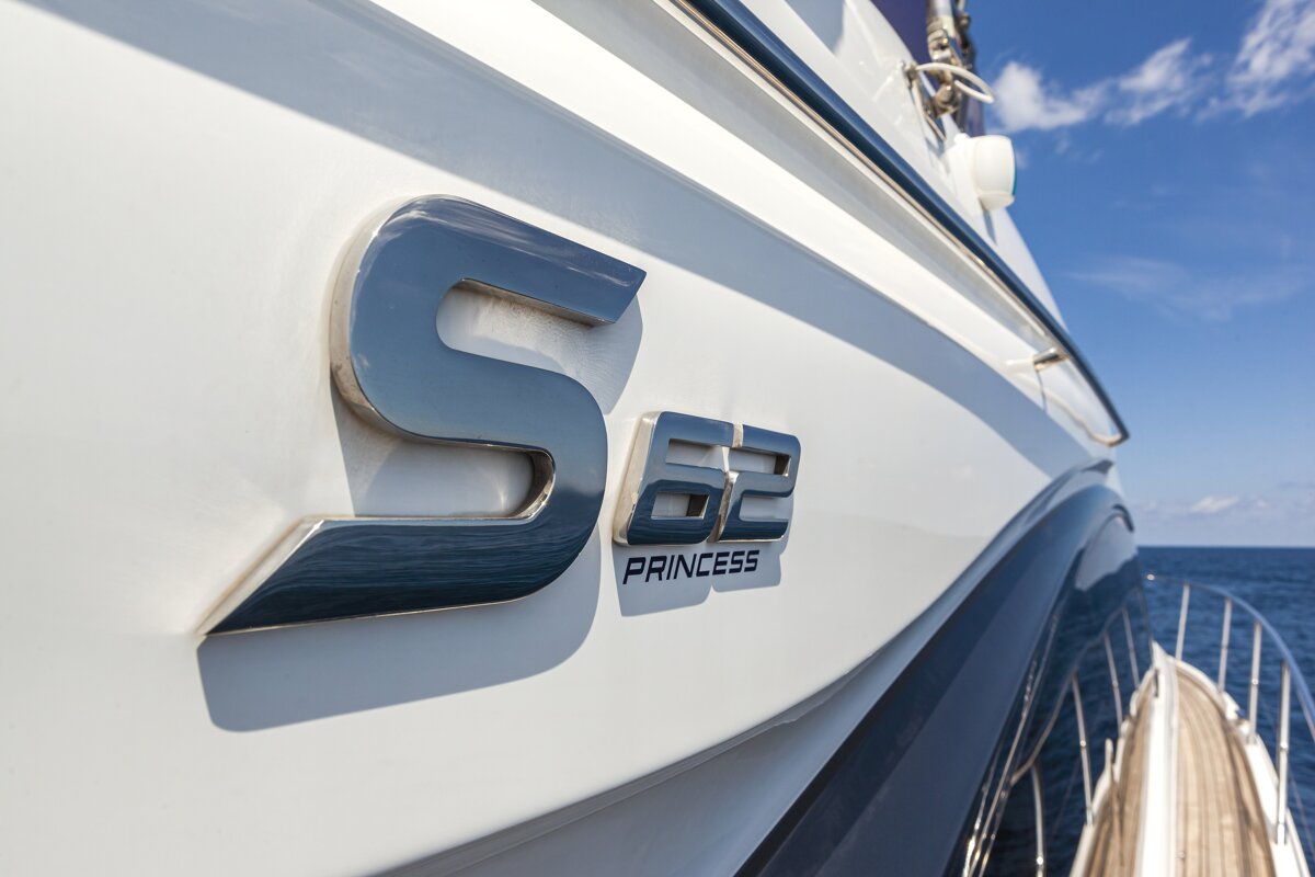The side of a princess s62 boat in the ocean