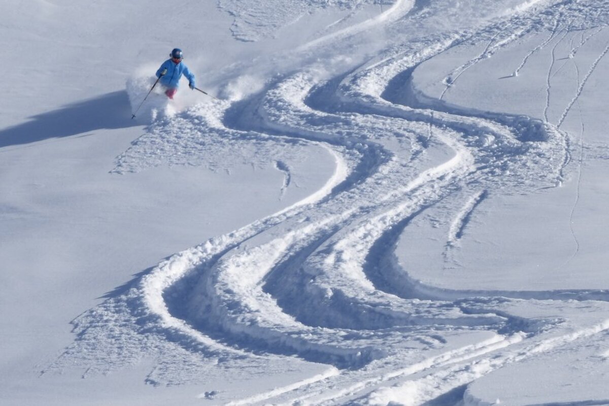 a woman skiing in deep powder