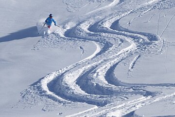 a woman skiing in deep powder
