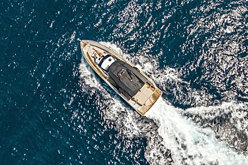 An aerial view of a boat in the ocean
