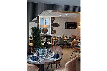 A restaurant with tables and chairs and a menu on the table