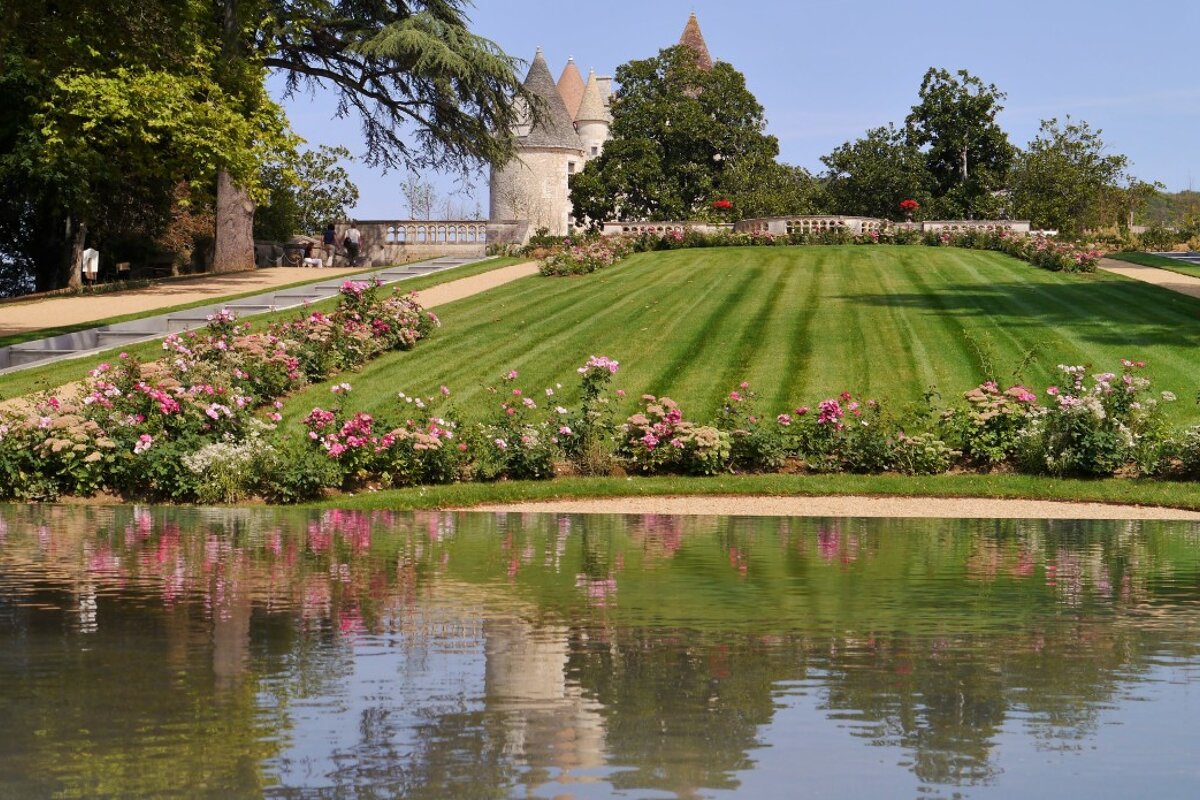 Looking at the chateau reflected in a lake