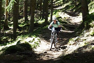 a mountain biker going through