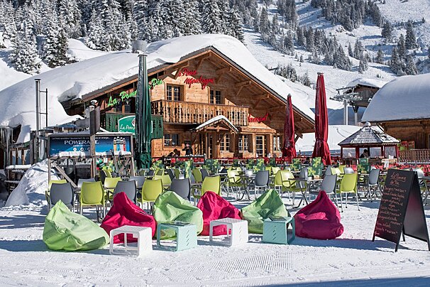 A snowy restaurant with a sign that says powerade
