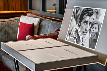 A black and white photo of a man titled everpresent