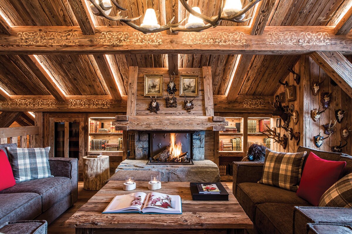 A living room with a fireplace and a book on the table