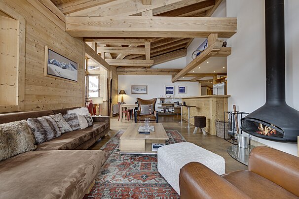 A living room with a fireplace and a couch