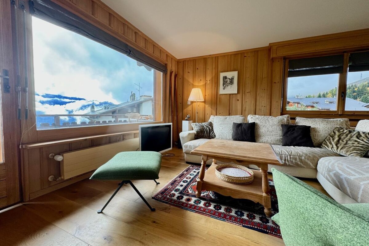 A living room with a couch and a table