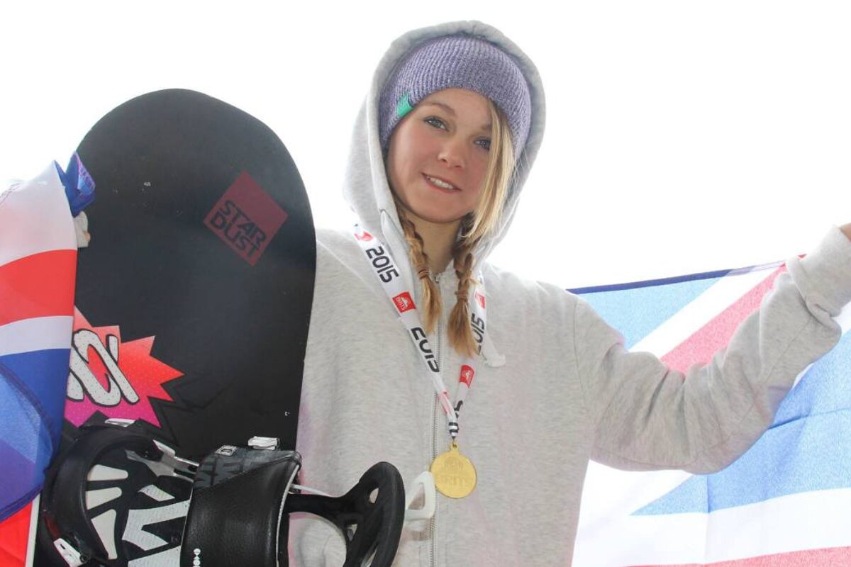 a young snowboarder with a gold medal