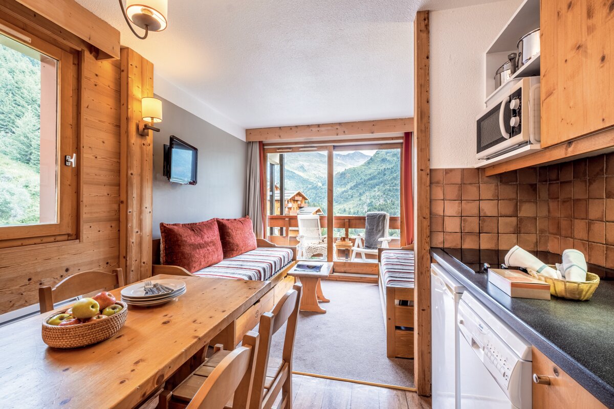 A living room with a couch and a television