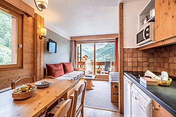 A living room with a couch and a television