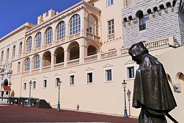 a staue outside the palace in monaco