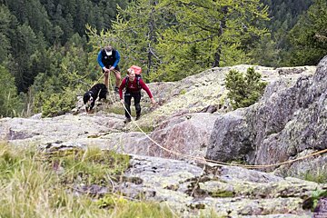 two men rescuing a dog in Chamonix