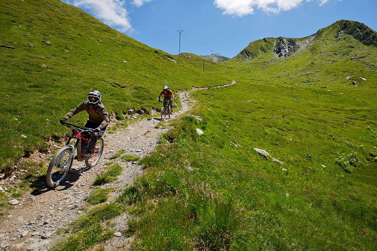 two mountain bikers on a MTB trail in la plagne