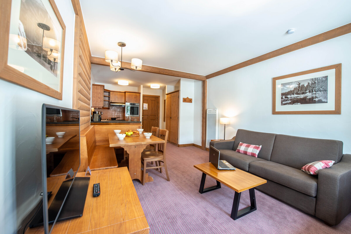 A living room with a couch and a flat screen tv
