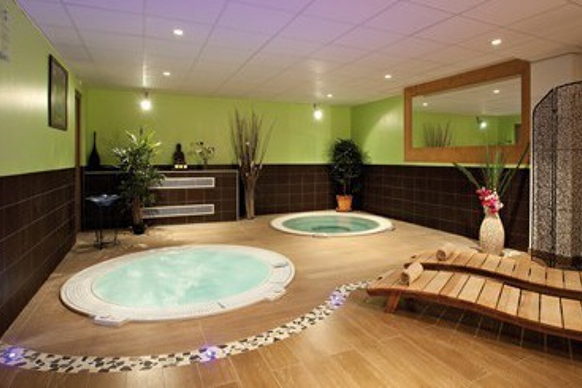 There is a jacuzzi in the middle of the room