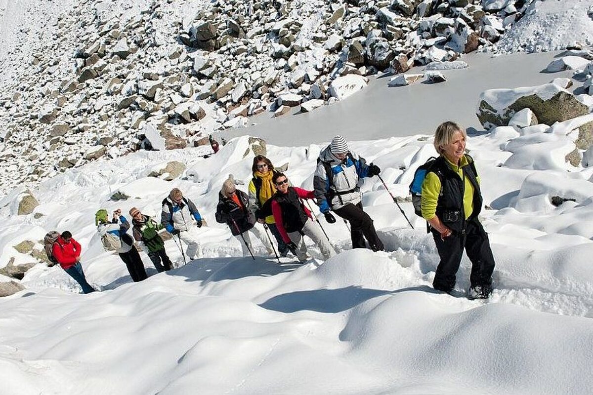 An image of women snowshoe hiking in the snow near chamonix mont blanc
