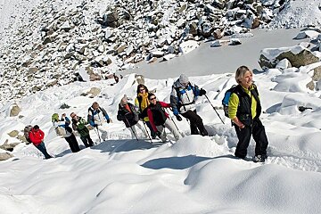 An image of women snowshoe hiking in the snow near chamonix mont blanc