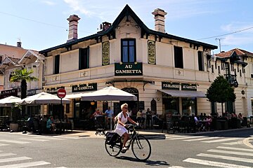 woman on bike in centre of arcachon