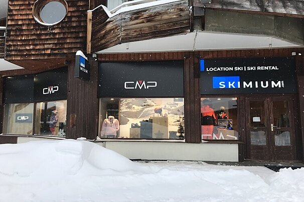 A cmp ski rental store is covered in snow