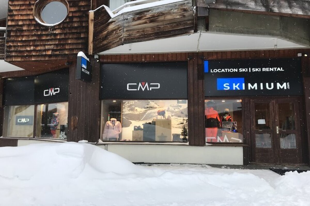 A cmp ski rental store is covered in snow