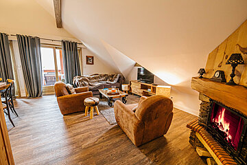 A living room with a fireplace and a couch