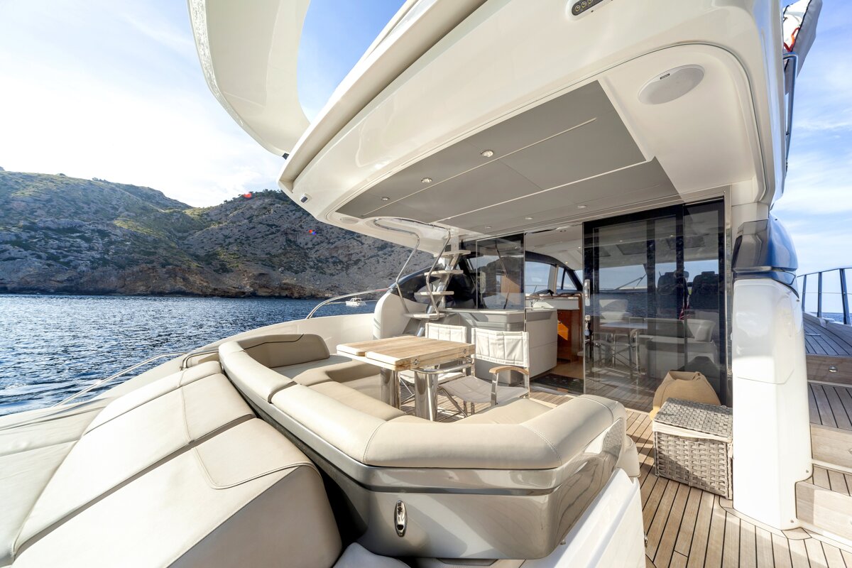 A boat with a table and chairs in the water