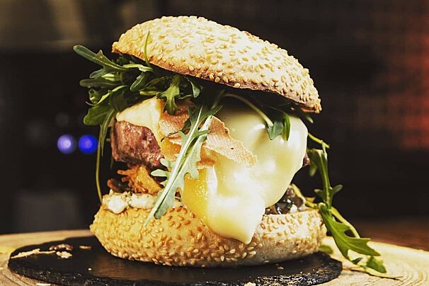 Delicious looking burger oozing cheese at Papa Renard in Morzine
