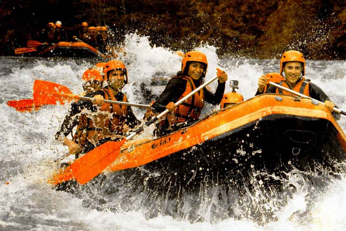 A group of people are rafting down a river and one of their rafts says o'neill
