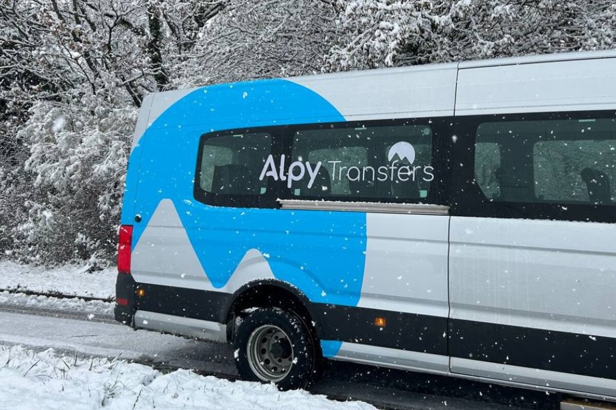A white van with the word aloy transfers on the side