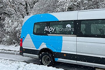 A white van with the word aloy transfers on the side