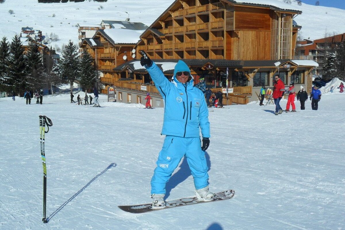 a ski instructor in a blue jacket