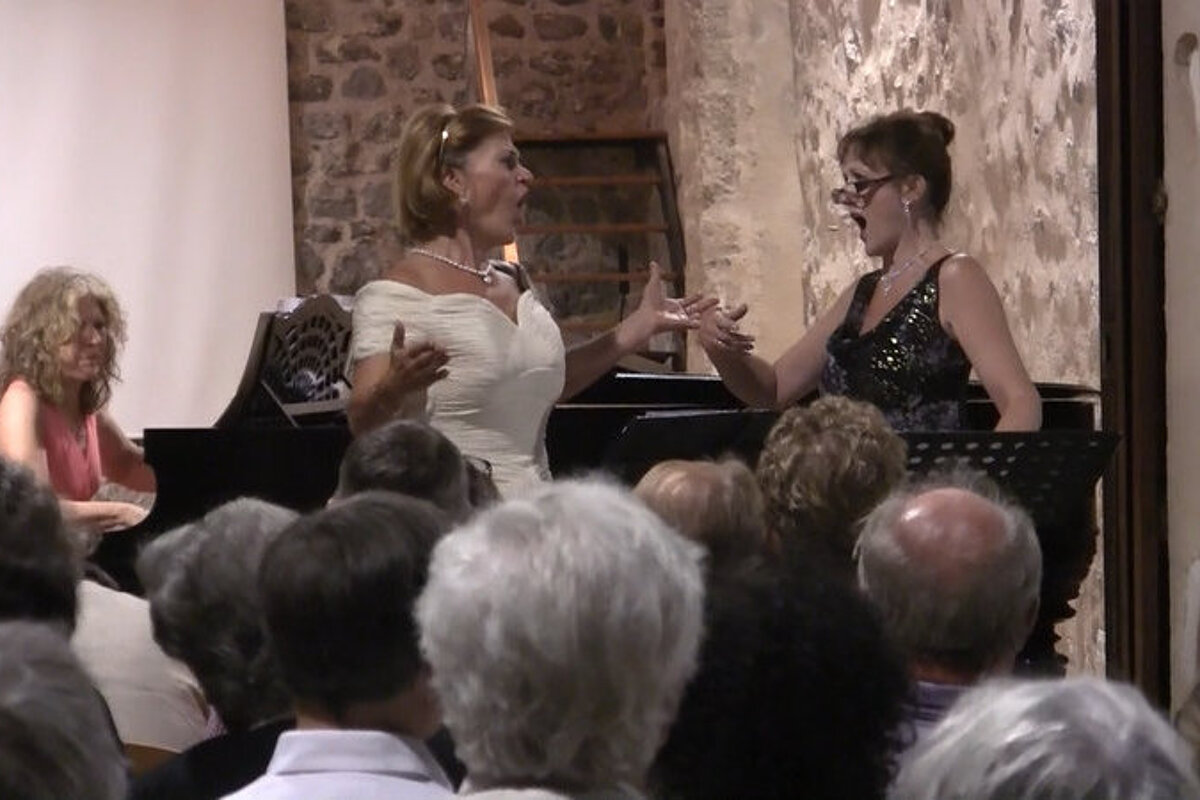 two singers and a pianist at a classical music concert