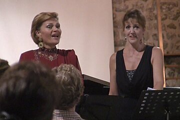 two female opera singers at a concert