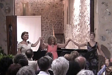 some classical singers celebrating at the end of a concert