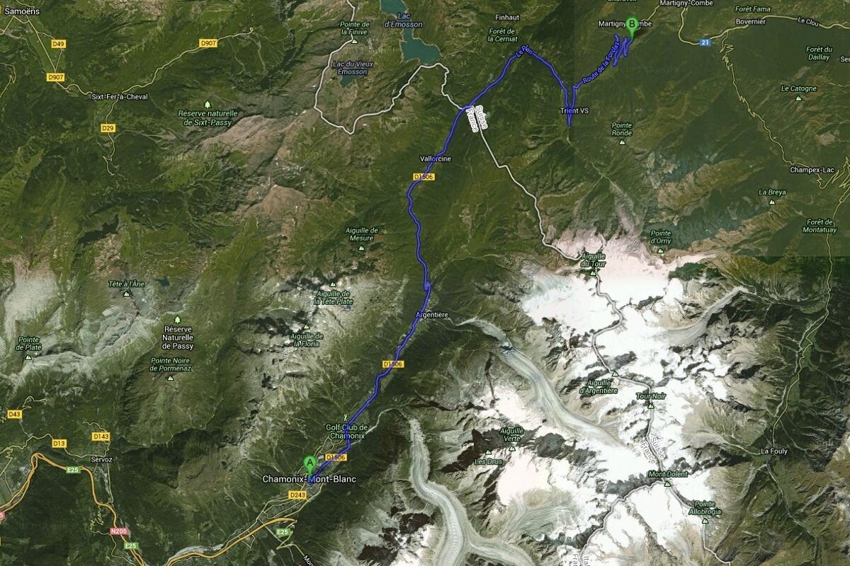 An aerial view of a mountain range with a blue line going through it