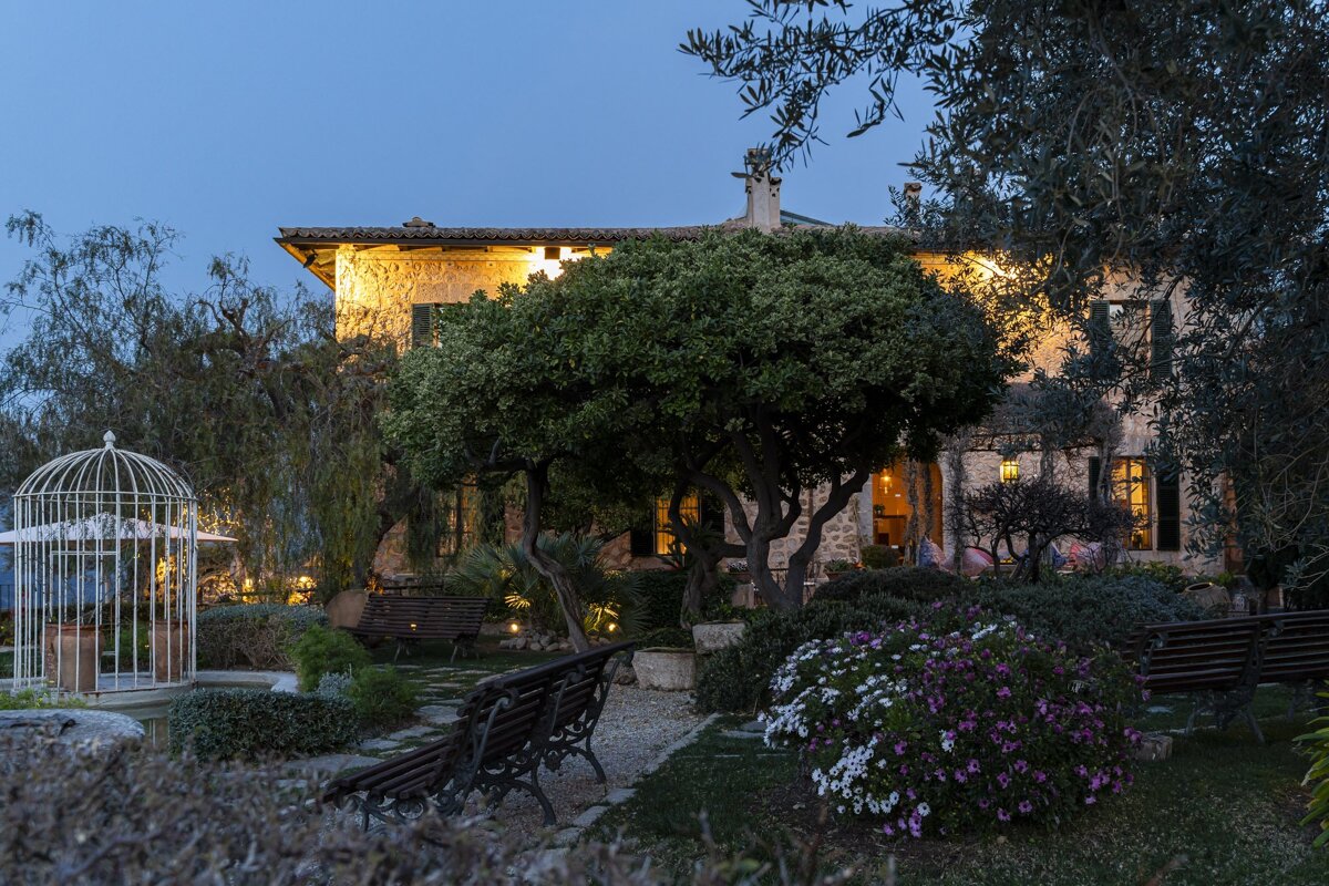 A large stone building with a gazebo in front of it
