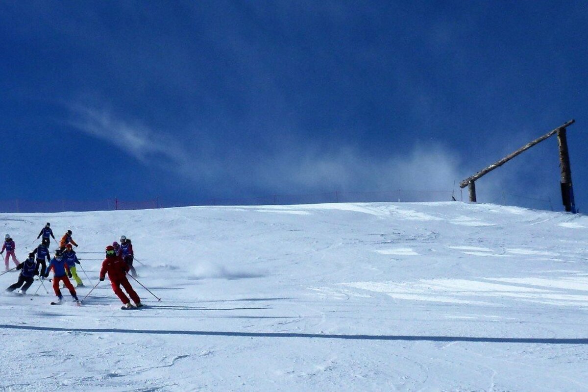 a ski instructor giving a group lesson