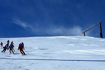 a ski instructor giving a group lesson