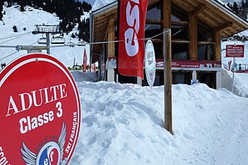 a ski instructor giving a group lesson