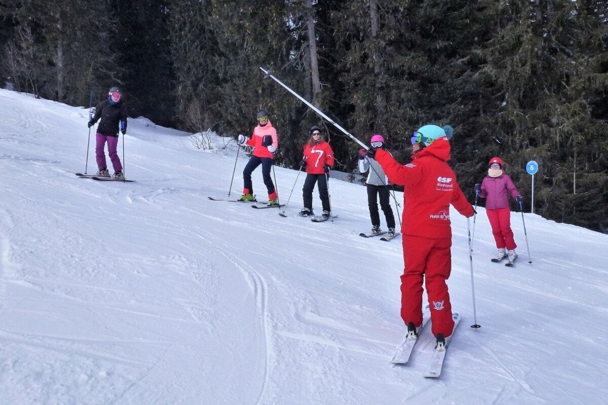a ski instructor giving a group lesson